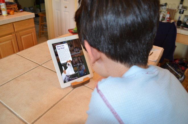 My oldest son reads a sample issue of Time for Kids on our iPad. He enjoyed the photography and we discussed the situation in the Ukraine. Photo: Patricia Vollmer.