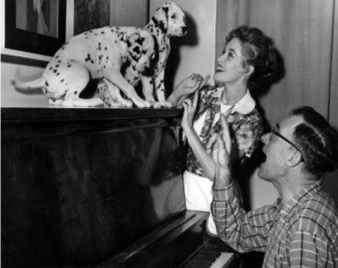 Lisa Davis gets into characterplaying with puppies before production. (Photo: Disney Studios)