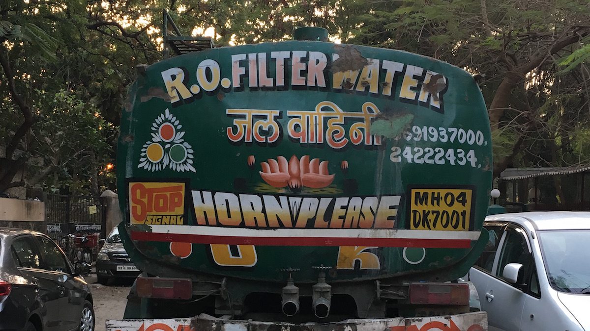 Back of truck in India where car horn is frequently used. "Horn OK Please" is common site.