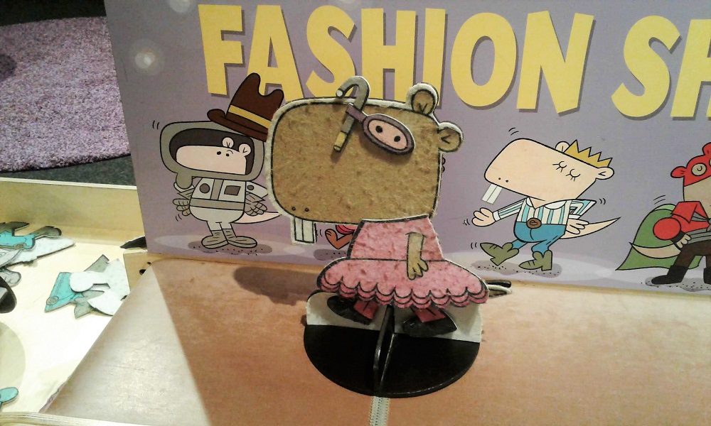Naked Mole Rat character cutout wearing a frilly dress with pants and swim goggles