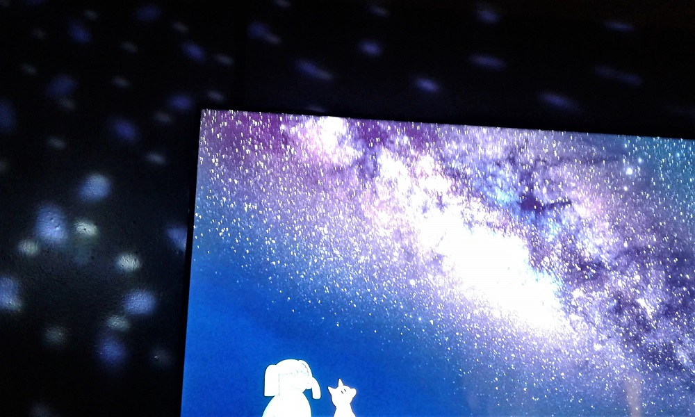 Inside the "Waiting" movie room when the walls swirl with stars and a galaxy swhooshed night sky graces the screen