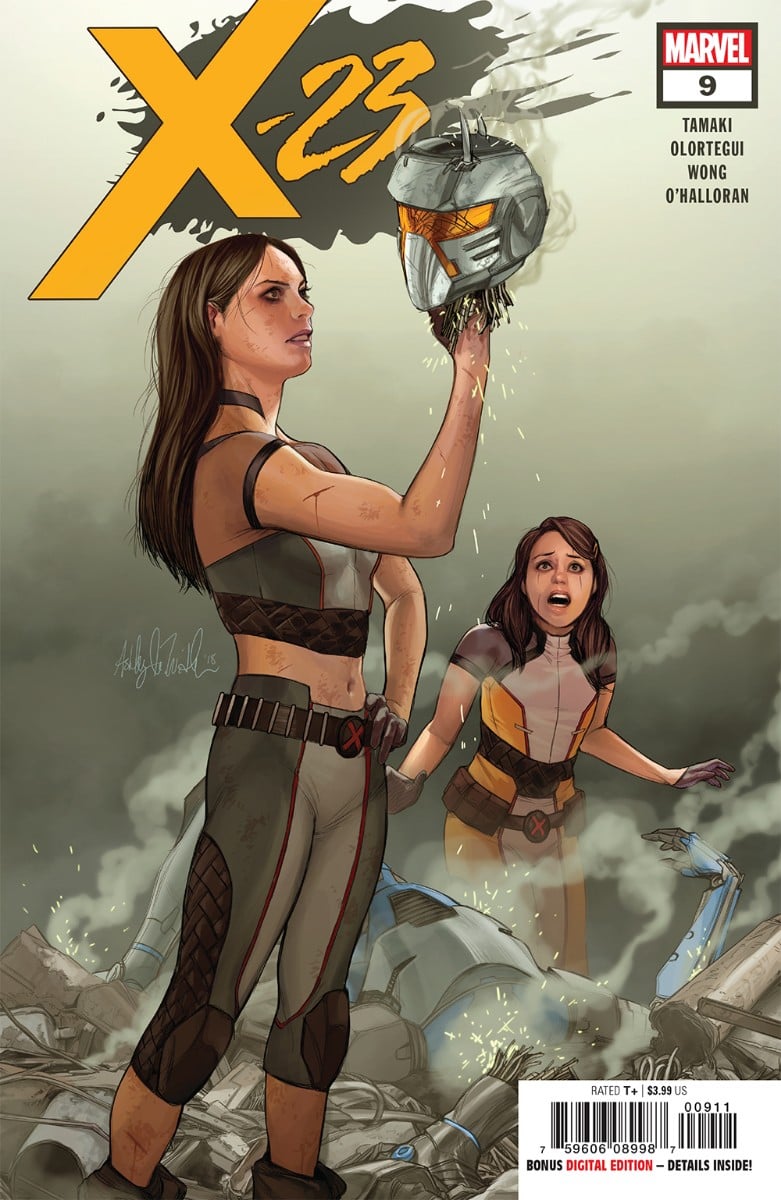 X-23 in the foreground holding up the head of a robot, Gabby in the background with a frightened expression