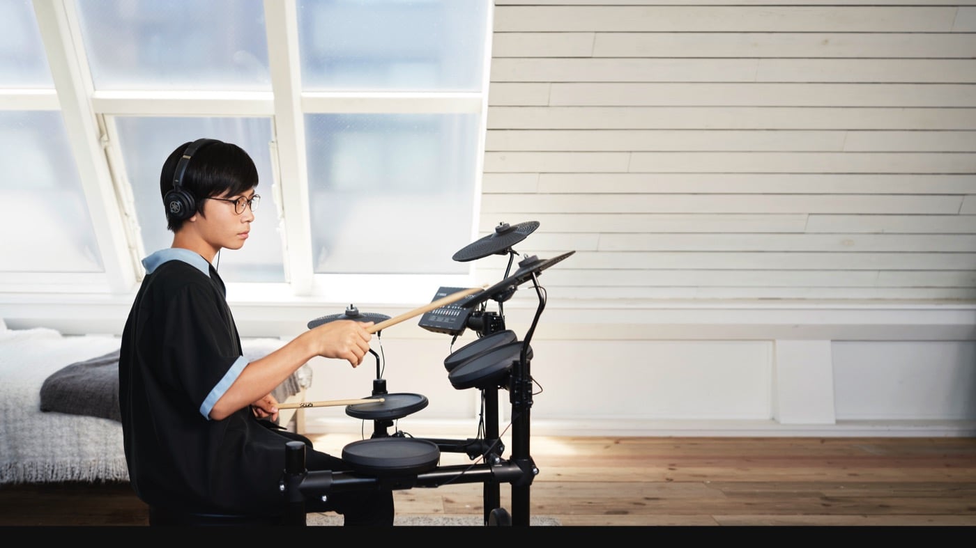 child playing electronic drums
