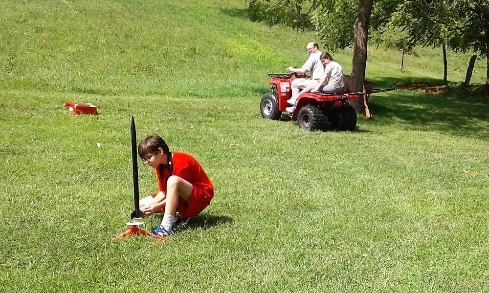 12yo hooks up rocket while dad and 10yo stand (sit) by on an ATV