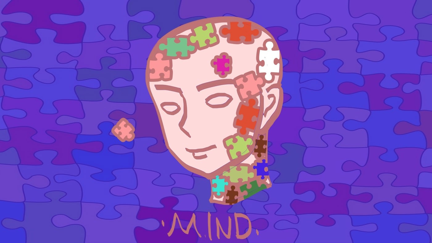 young brain with puzzle pieces representing mental fitness