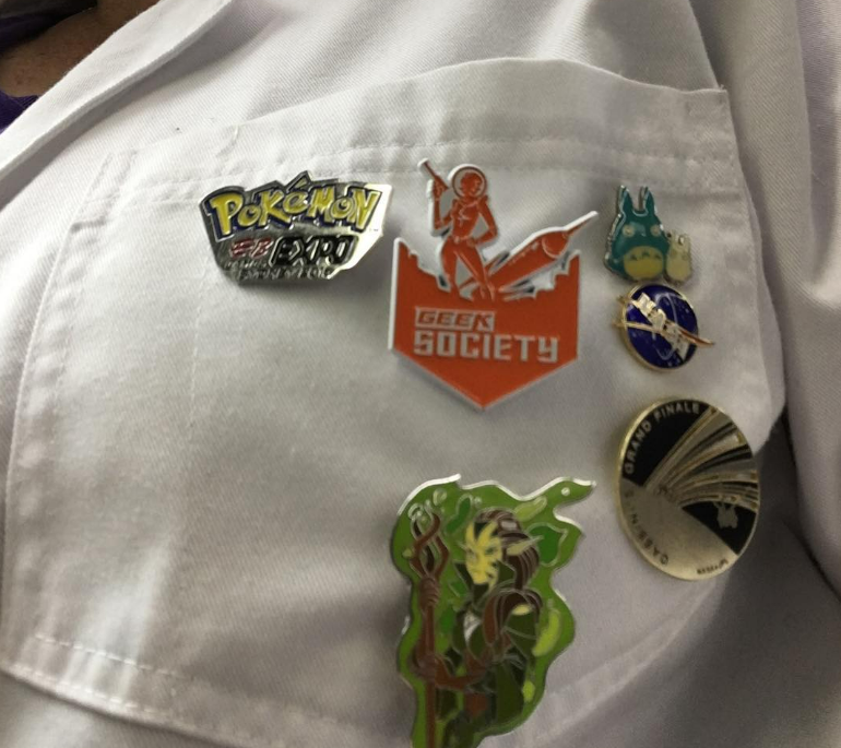 image of PAX pins on lab coat
