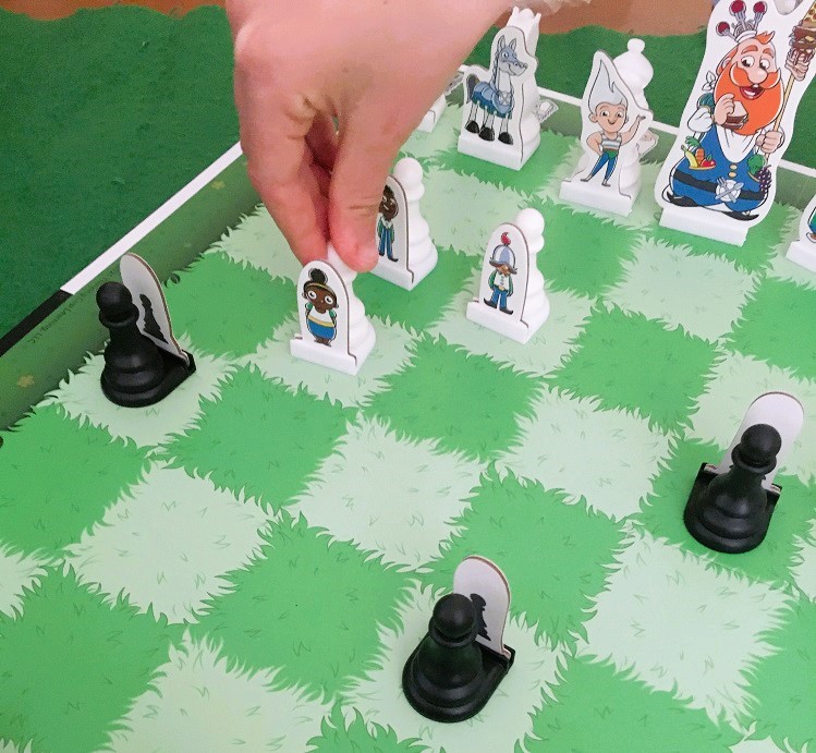 Image of young child playing regular game of STORY TIME CHESS